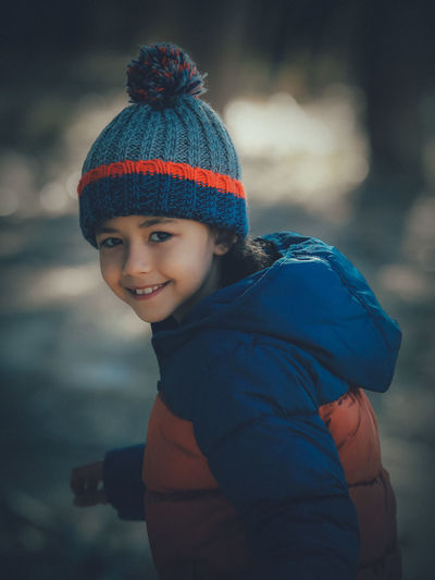 Portrait of smiling boy in snow