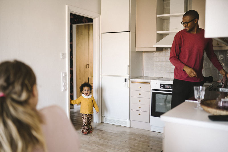 Family with daughter in kitchen