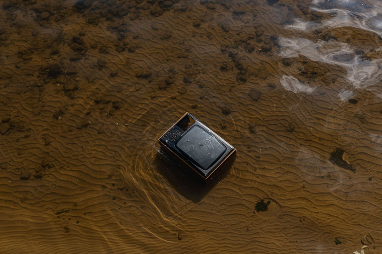 High angle view of television in water