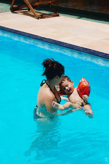 Mother with son in the swimming pool