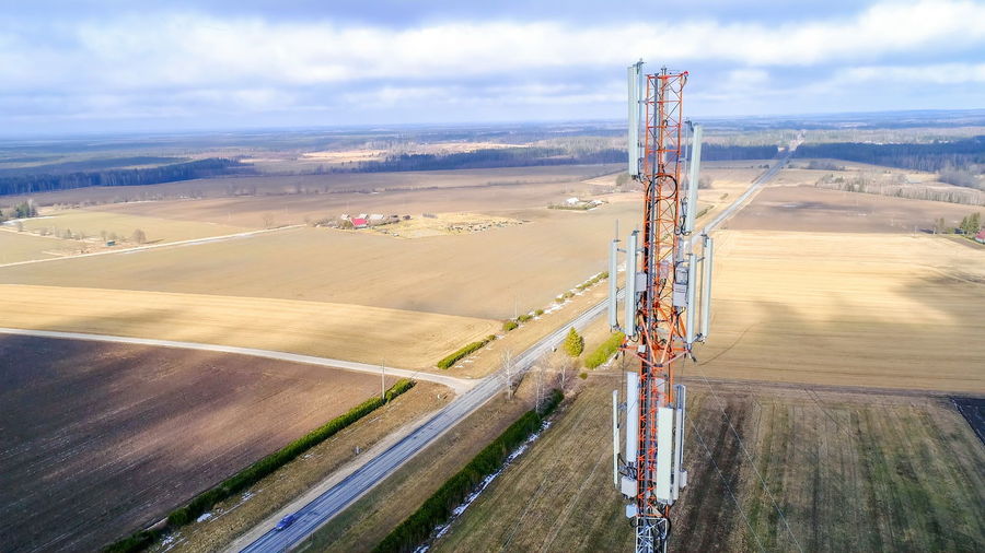 High angle view of communications tower against cloudy sky