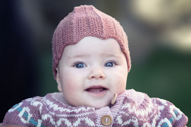Close-up portrait of cute baby girl outdoors