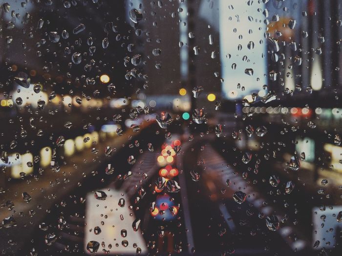 Full frame shot of wet car window in rainy season