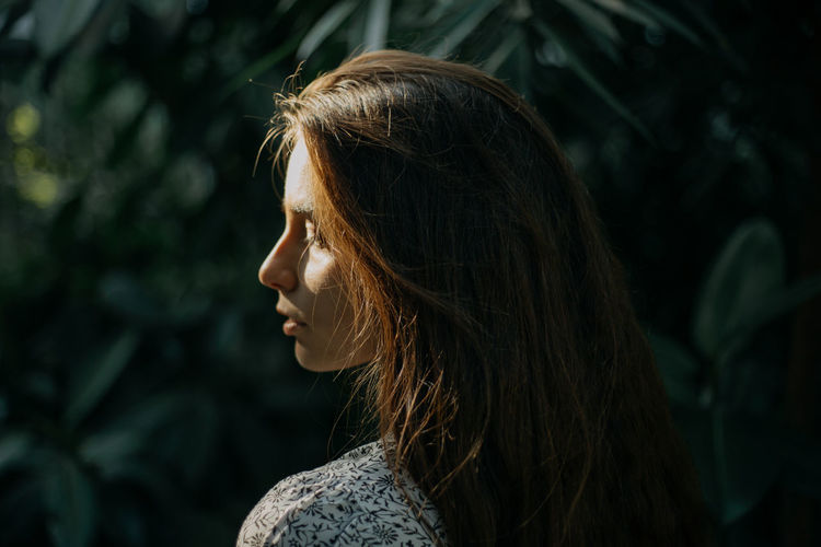 A close up portrait of a woman during sunset