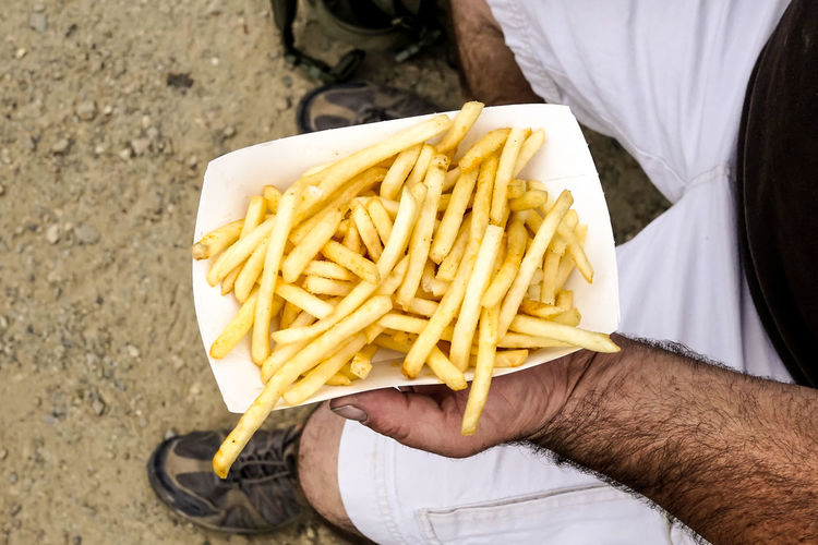 Man holding fries