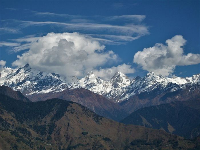 Scenic view of snowcapped mountains against clear sky