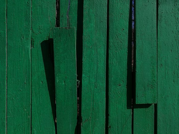 Full frame shot of green wooden door