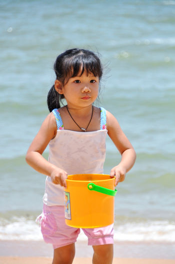 Full length of a girl holding beach
