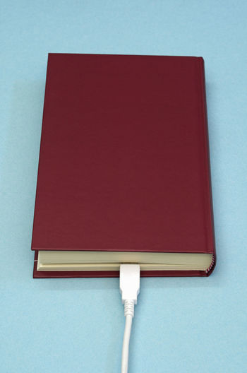 Close-up of red open book on table