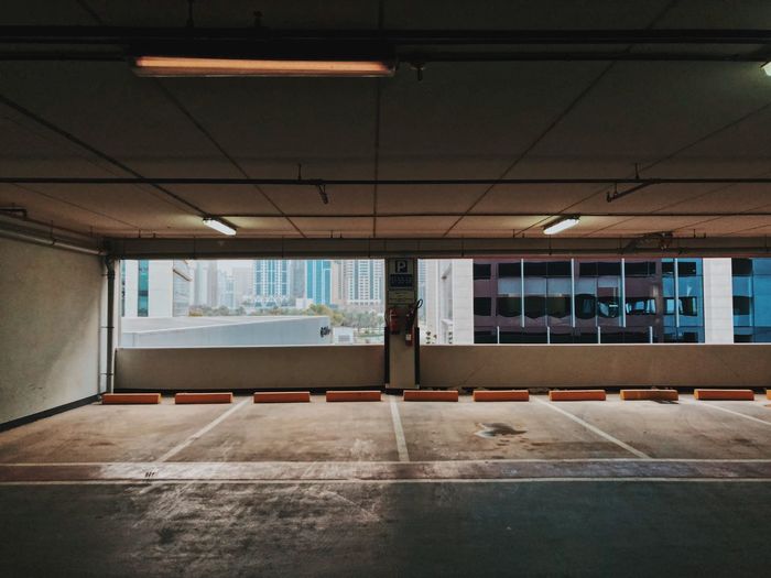 Interior of illuminated empty parking lot