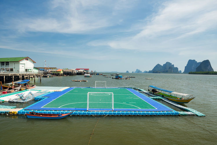  floating football or soccer field at panyee island and limestone mountains, phang nga