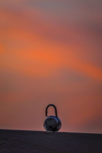 Lock against sky during sunset