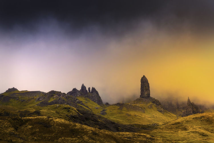 Old man storr in isle of skye with magic orange light abstract feel