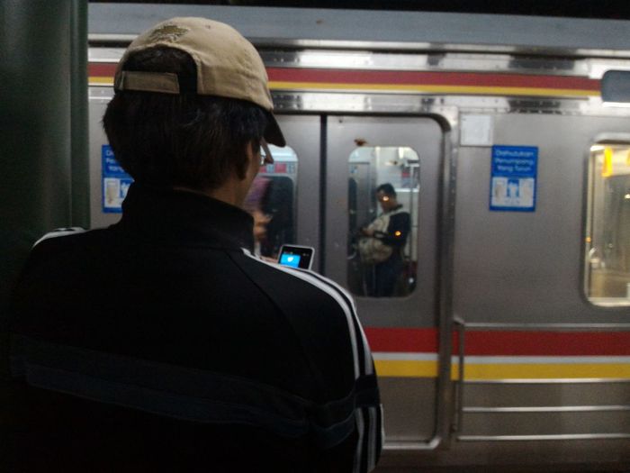 Rear view of man train at railroad station