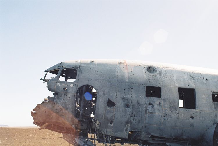 Abandoned airplane against clear sky