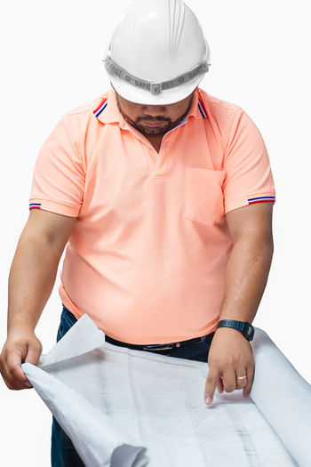 Midsection of man working on white background