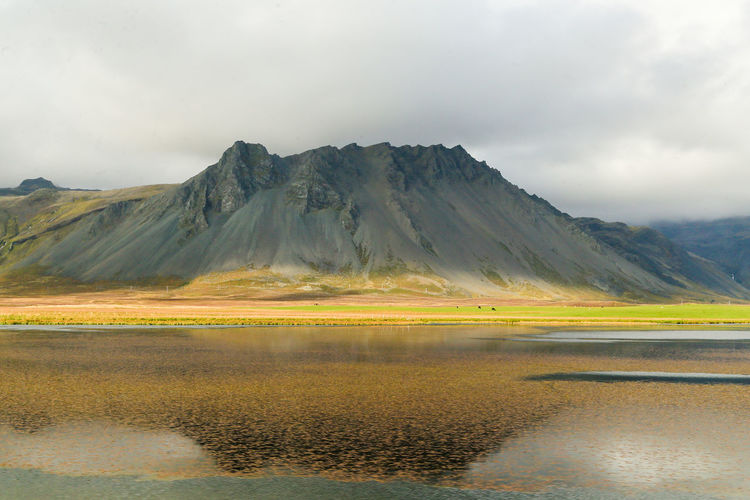 Reflection of the mountain in the water at the north of iceland