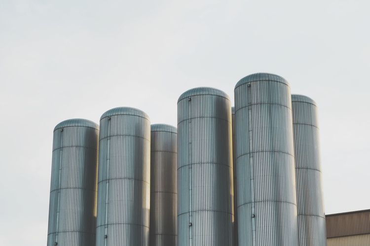 Low angle view of a factory against clear sky