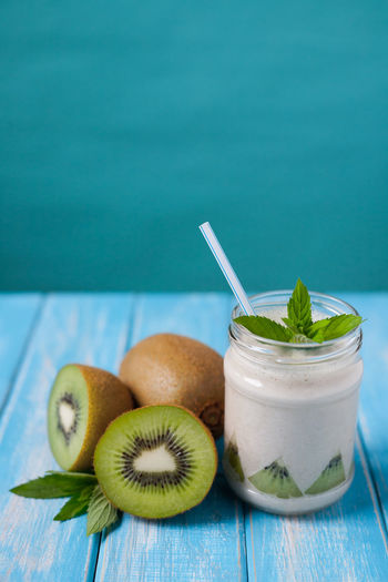 Close-up of kiwi drink on table