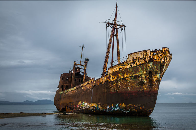 Abandoned ship at shore