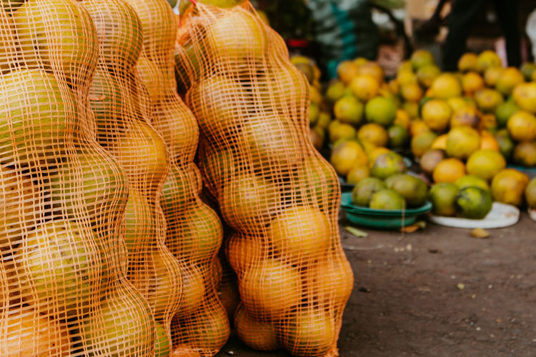 Orange fruits for sale at street market 