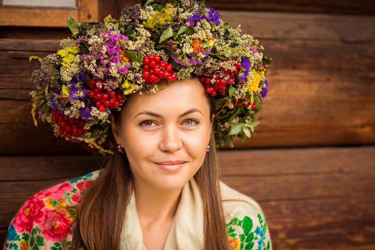 Young pretty ukrainian woman with a wreath of dry herbs on her head
