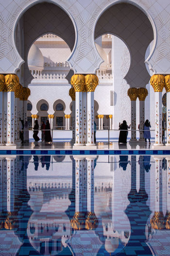 Reflection of buildings in swimming pool
