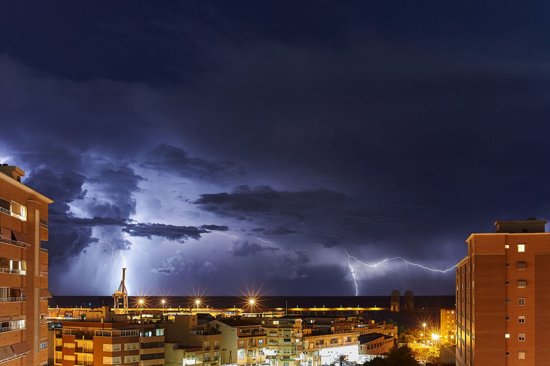 Buildings in city at night