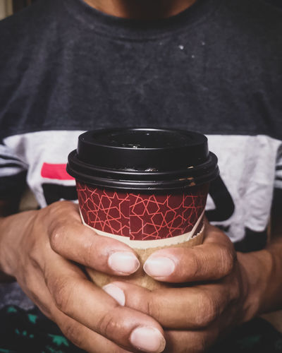 Close-up of man holding ice cream