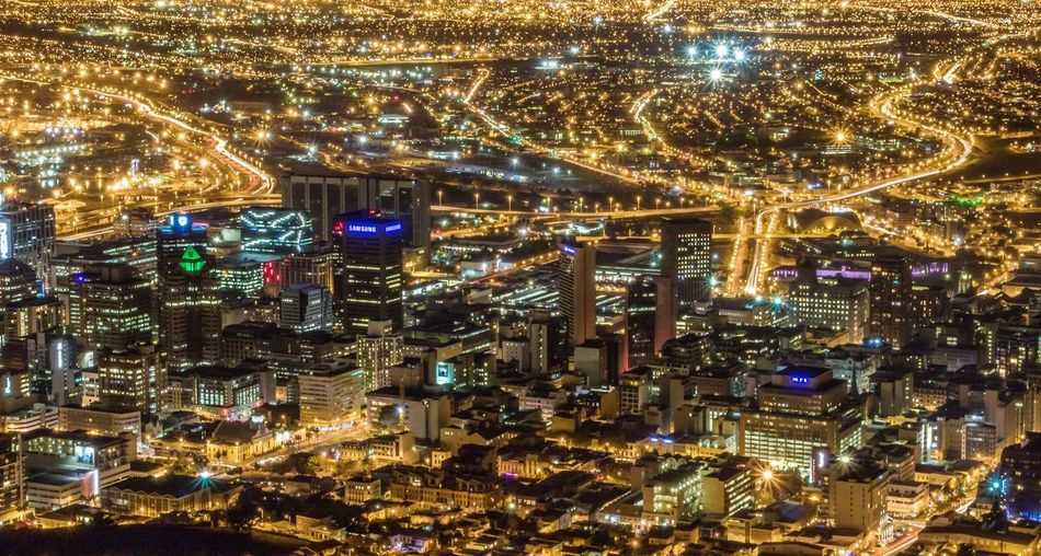 Aerial view of city illuminated at night