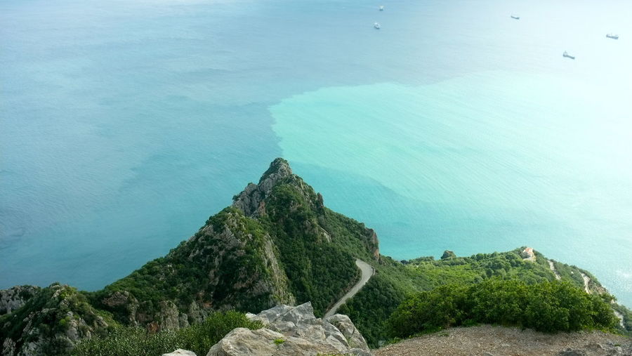 High angle view of mountain against sea