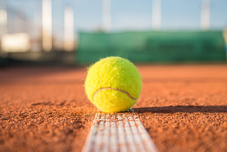 Close-up of yellow ball on table