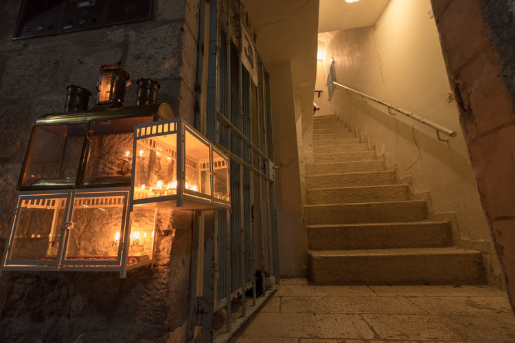 Low angle view of illuminated steps in buildings