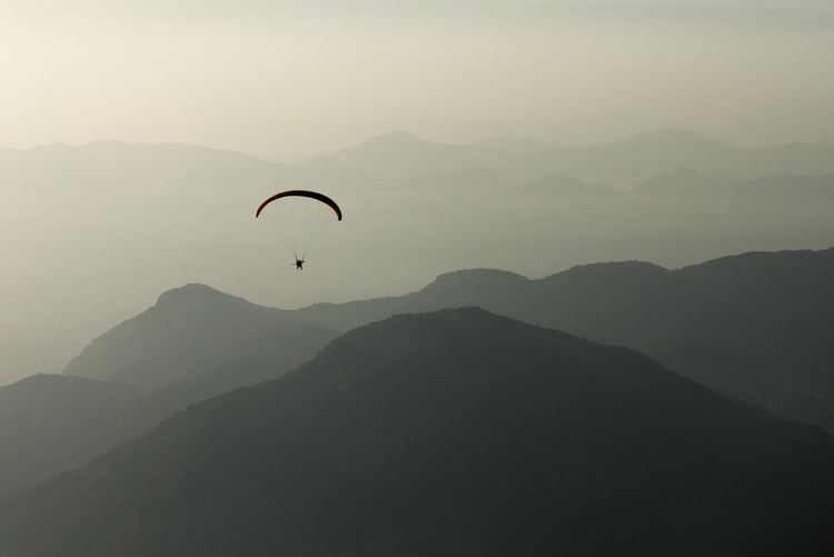 Paraglider over mountains 