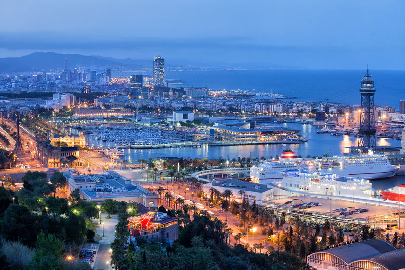 High angle view of illuminated cityscape against sky at night