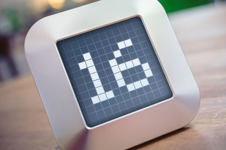Close-up of number 16 on digital display at table