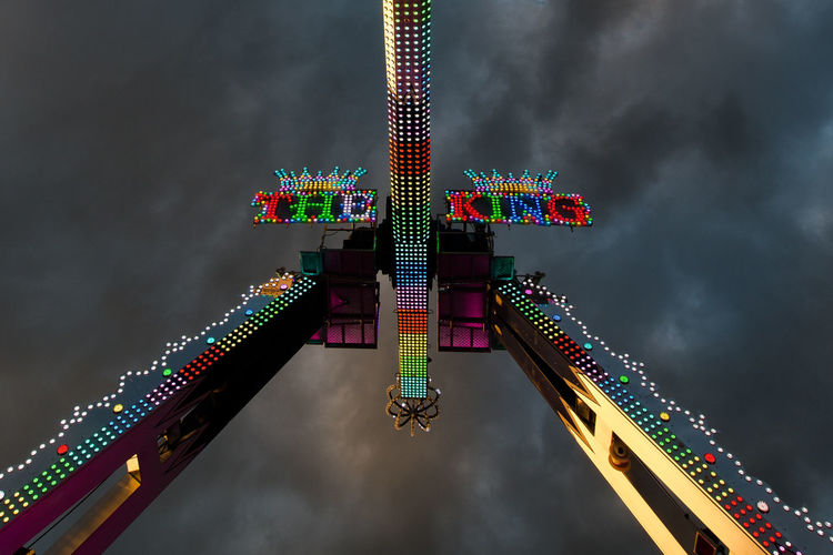 Low angle view of illuminated building against sky