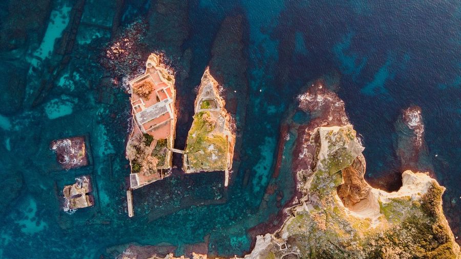Aerial view of rock formation in sea
