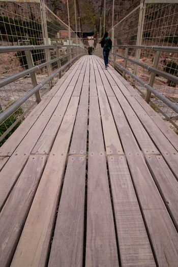 High angle view of man standing on boardwalk