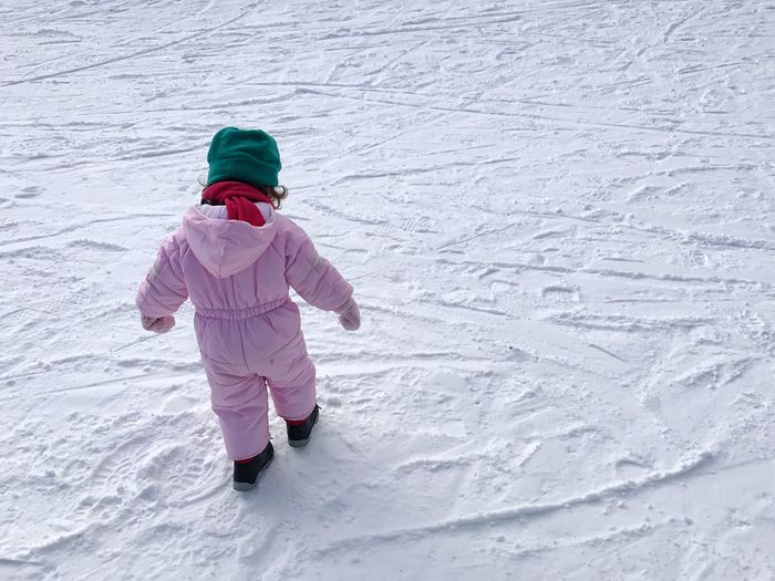 Full length of girl standing on snow