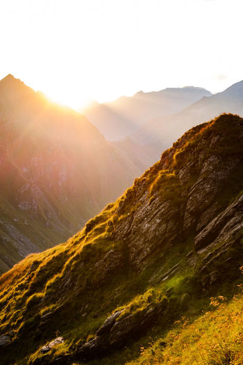 Scenic view of mountains against sky during sunset