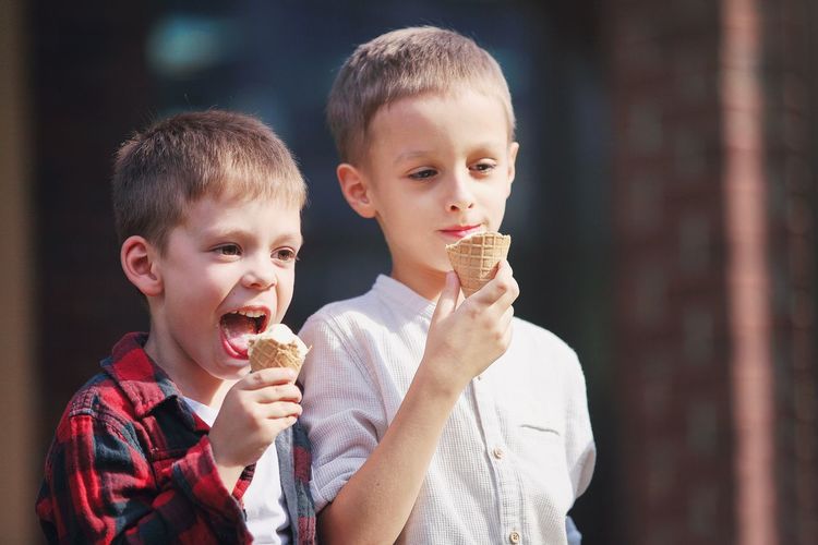 Cute boys eating ice cream