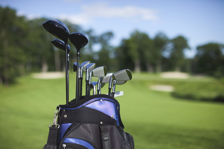 Close-up of golf clubs in bag