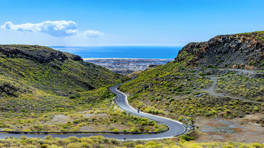 Scenic view of landscape against blue sky