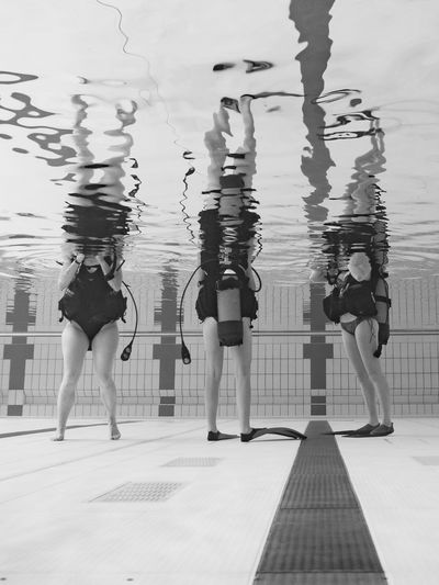 Low section of people in swimming pool