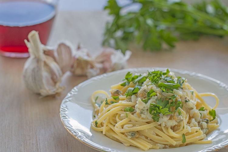 A dish with linguine pasta with fish.