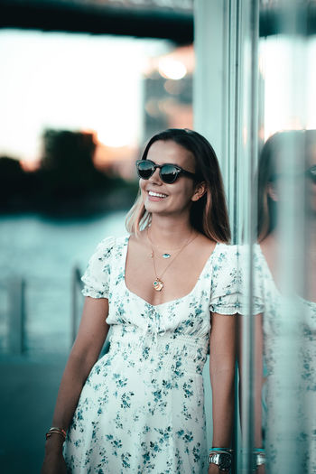 Young woman wearing sunglasses standing outdoors
