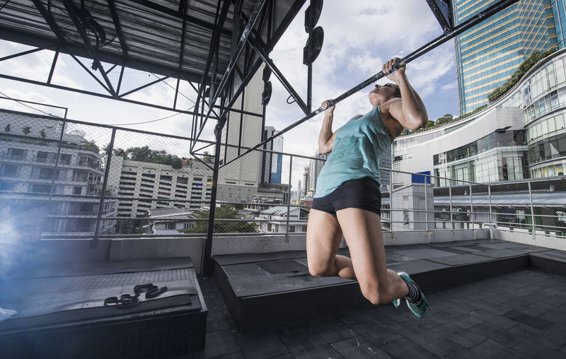 Woman training at rooftop gym in bangkok