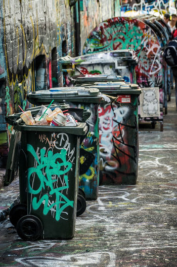 Graffiti on garbage bins by the street