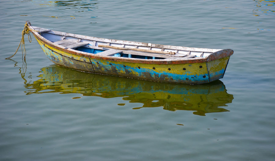 A beautiful image of single boat. boat on the lake. a single boat on the clear surface of the lake.